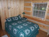 Queen size bed in master bedroom with private bath